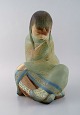 Lladro, Spain. Large sculpture in glazed ceramics. Sitting girl. 1980s.
