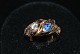 Antik Huset 
presents: 
Snake Ring 
with Diamond 
and Sapphire, 
14 Karat Gold
Size: 56
