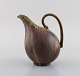 Arne Bang. Jug with handle in glazed ceramics. Model number 161. Beautiful glaze 
in green and brown shades. 1940/50