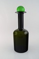 Otto Brauer for Holmegaard. Large vase / bottle in green art glass with green 
ball. 1960