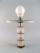 Scandinavian designer table lamp in steel and art glass. Mid-20th century.