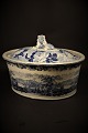 Antique oval, Swedish 1800 century Rørstrand pate terrine in faience with blue 
glaze with landscape motifs and lying lion on top of the lid.