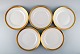 Royal Copenhagen stel nr. 607, White. Five porcelain dinner plates with gold 
edge. Model number 607/9586.

