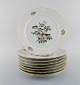 8 Royal Copenhagen "Forår" middagstallerkener i porcelæn med motiver af fugle og 
bladværk. 1980