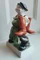 Herend figure in porcelain, Hungary: Shoemaker apprentice with new boots