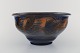 Kähler, Denmark. Bowl in glazed stoneware. Orange foliage on blue background. 
1930 / 40s.
