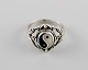 Swedish silversmith. Classic ring in sterling silver adorned with yin / yang. 
1960 / 70s.
