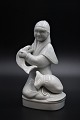 Royal Copenhagen porcelain figure of "Fisherman with his catch" in Blanc de 
chine by Georg Thylstrup. H:18cm.