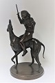 Lundin Antique 
presents: 
Bronze 
figure. Boy 
sitting on 
greyhound. 
Height 45 cm.
