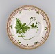 Royal Copenhagen Flora Danica dinner plate in hand-painted porcelain with 
flowers and gold decoration. Model number 20/3549.
