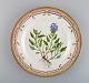 Royal Copenhagen Flora Danica dinner plate in hand-painted porcelain with 
flowers and gold decoration. Model number 20/3549.
