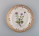 Royal Copenhagen Flora Danica salad plate in hand-painted porcelain with flowers 
and gold decoration. Model number 20/3573.
