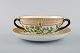 Royal Copenhagen Flora Danica boullion cup with saucer in hand-painted porcelain 
with branch-shaped handles, flowers and gold decoration. Model number 20/3612.
