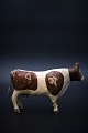 Decorative carved cow in painted wood with a really nice old patina. Originally 
old toy from the 30s. H:12.5cm. L:20cm.