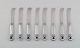 Eight Georg Jensen Acorn butter knives in all sterling silver.
