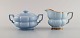 Arthur Percy for Upsala-Ekeby / Gefle. Art deco Grand sugar bowl and creamer in 
pastel blue porcelain with hand-painted gold edge. 1930s / 40s.
