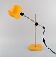 Swedish designer. Adjustable retro desk lamp in yellow lacquered metal and 
chrome. 1970s.
