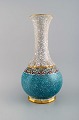 Stor Dahl Jensen vase i krakeleret porcelæn med guld og turkis dekoration. 
1930