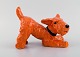 Ida Meisinger (1897-1985) for Goldscheider. Playful terrier in glazed ceramics. 
Beautiful glaze in orange shades. 1930