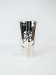 Vase decorated with a rose of hallmarked silver.
5000m2 showroom.
