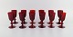 Monica Bratt for Reijmyre. Tolv hedvinsglas i rødt mundblæst kunstglas. 
1950
