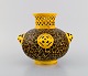 L'Art presents: 
Antique 
Zsolnay vase in 
openwork glazed 
ceramics. 
Beautiful glaze 
in yellow and 
brown shades. 
...