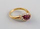 Scandinavian jeweler. Ring in 18 carat gold adorned with diamonds and purple 
stones. Mid-20th century.
