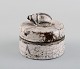 European studio ceramicist. Unique lidded jar in glazed ceramics. Lid shaped as 
a snail shell. Dated 1998.
