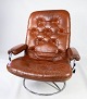Easy chair upholstered with brown patinated leather of norwegian design from the 
1970s. 
5000m2 showroom.
