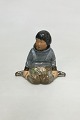 Royal Copenhagen overglaze regional figurine of boy with flowers "Grønland" = 
"Greenland" No 12419