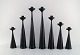 A collection of seven Scandinavian designer candlesticks in wood and brass. 
Modernist and clean design. 1960s.
