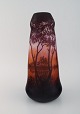 L'Art presents: 
Daum 
Nancy, France. 
Large antique 
vase in mouth 
blown art glass 
decorated with 
lake landscape 
...