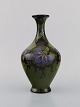 Regina, Holland. Antique art nouveau vase in glazed ceramics with hand-painted 
flowers and foliage. Approx. 1910.
