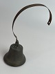 Old shop bell in farmhouse style of patinated metal. 1900s.