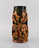 Michael Andersen, Denmark. Art nouveau vase in glazed ceramics with hand-painted 
foliage in brown and orange shades. 1920s / 30s.
