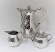 Lundin Antique 
presents: 
Mogens 
Björn Andersen. 
Silver coffee 
service (925). 
Consisting of 
coffee pot, 
cream ...