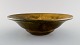 Svend Hammershøi for Kähler, Denmark. Bowl in glazed stoneware. Beautiful yellow 
uranium glaze. 1930s / 40s.
