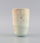 Danish studio ceramicist. Unique vase in glazed stoneware. Beautiful glaze in 
delicate light and peach shades. Late 20th century.
