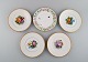 Five antique Royal Copenhagen porcelain plates with hand-painted flowers, 
insects and a gold border. Late 19th century.
