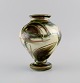 Kähler, Denmark. Vase in glazed ceramics. Flowers on a cream colored background. 
Modern design, 1930s / 40s.
