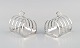 Mappin & Webb Ltd, Sheffield & London. Two toast racks in sterling silver. Early 
20th century.
