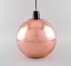 Tom Dixon (b. 1958), British designer. Round copper colored ceiling pendant. 
Clean design, 21st Century.
