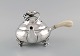 Georg Jensen Blossom teapot in hammered sterling silver with ivory handle. Model 
2C. Dated 1915-1930.
