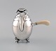 L'Art presents: Georg Jensen Blossom chocolate pot in hammered sterling silver with handle of ivory. Model 2A. ...