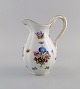 Antique Meissen porcelain jug with hand-painted gold decoration, flowers and 
insects. 19th century.
