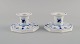 A pair of Royal Copenhagen Blue Fluted Plain Candlesticks. Model number 1/3334. 
Dated 1958.
