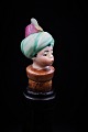 Funny, old wine stopper in painted porcelain with bust of Aladdin.