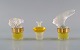 Tre Lalique parfumeflakoner. Sent 1900-tallet.

