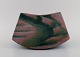 European studio ceramicist. Unique bowl in glazed ceramics. Beautiful marbled 
glaze. Dated 1986.
