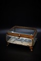 Large 1800 century French jewelry box in bronze with faceted glass, light blue 
silk cushion at the bottom.
H:11cm. W:20cm. D:18cm.